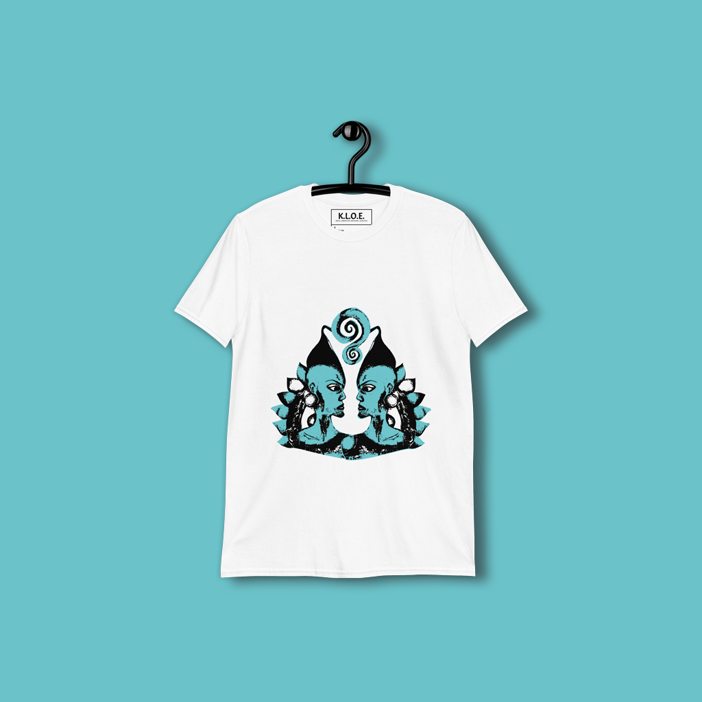 White K.L.O.E. t-shirt featuring a hand-drawn design of two mirrored faces in bold black and teal, showcasing cultural inspiration, individuality, and modern bohemian style self-expression.