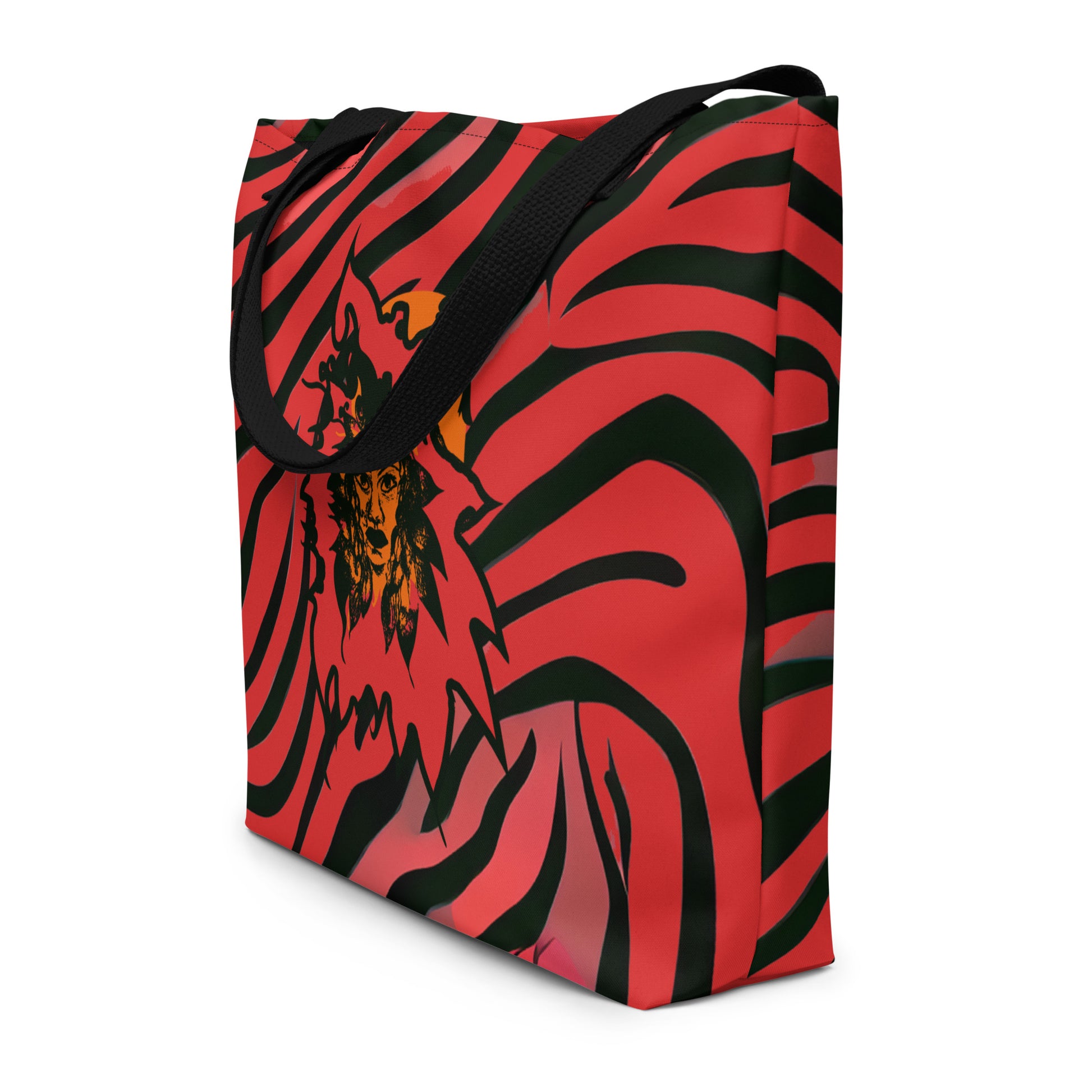 Large red and black tote bag from Kloe Store featuring a bold artistic face design and abstract swirling patterns, with black straps, perfect for trendy and functional everyday use, detail view.