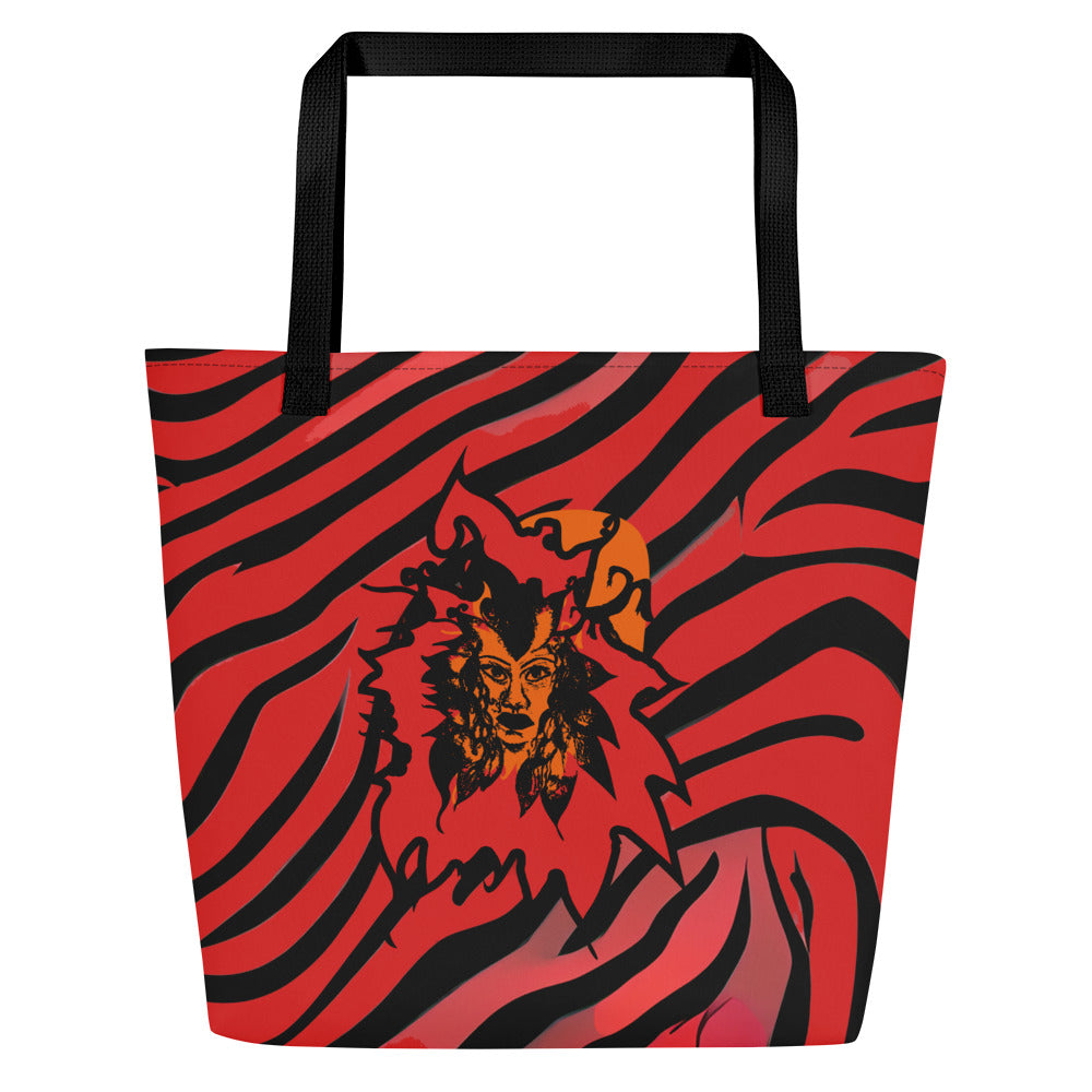 The hand holding a large red and black tote bag from Kloe Store featuring a bold artistic face design and abstract swirling patterns, with black straps, perfect for trendy and functional everyday use, detail view.