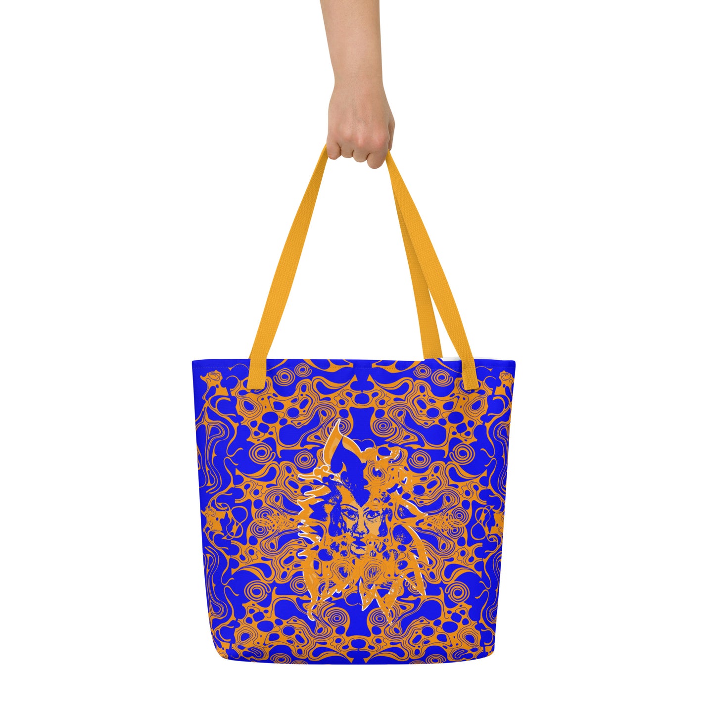 Bold blue and orange tote bag from Kloe Store featuring intricate abstract patterns and a central artistic face design, offering a stylish and edgy streetwear look.