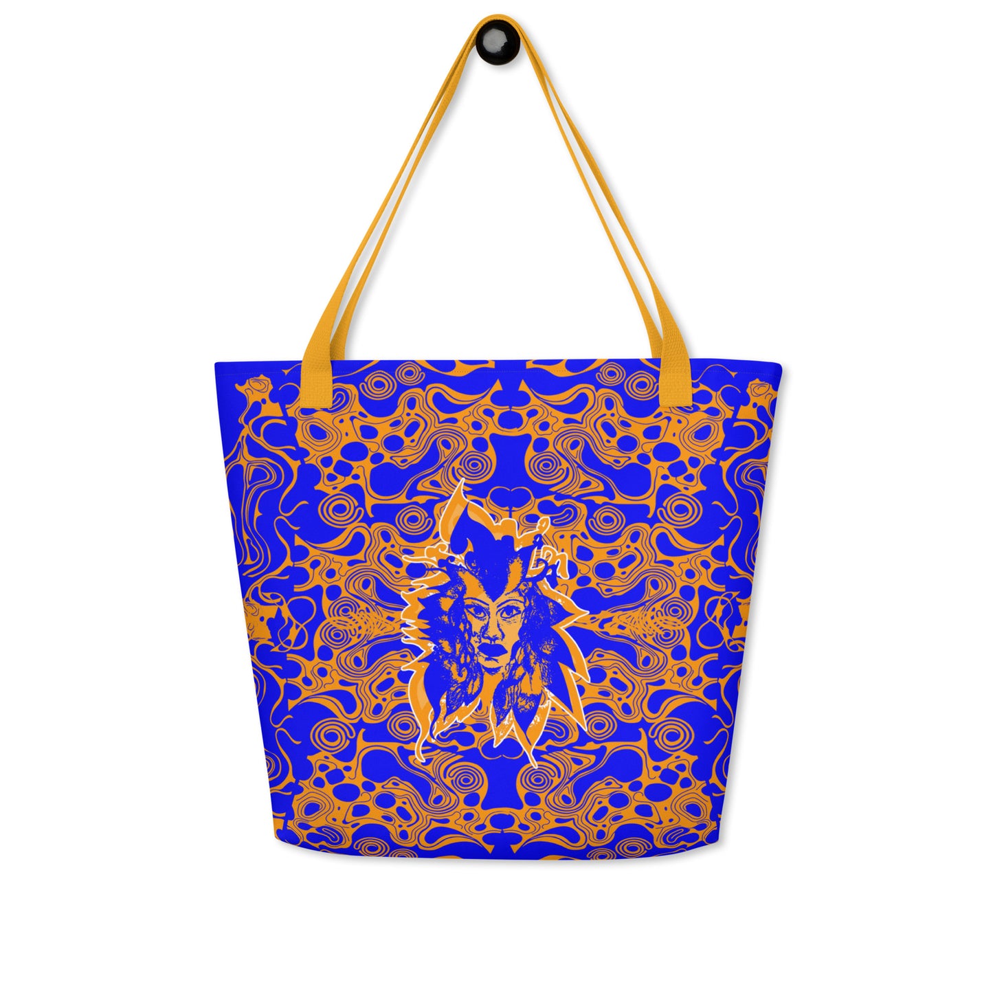 Bold blue and orange tote bag from Kloe Store featuring intricate abstract patterns and a central artistic face design, offering a stylish and edgy streetwear look.