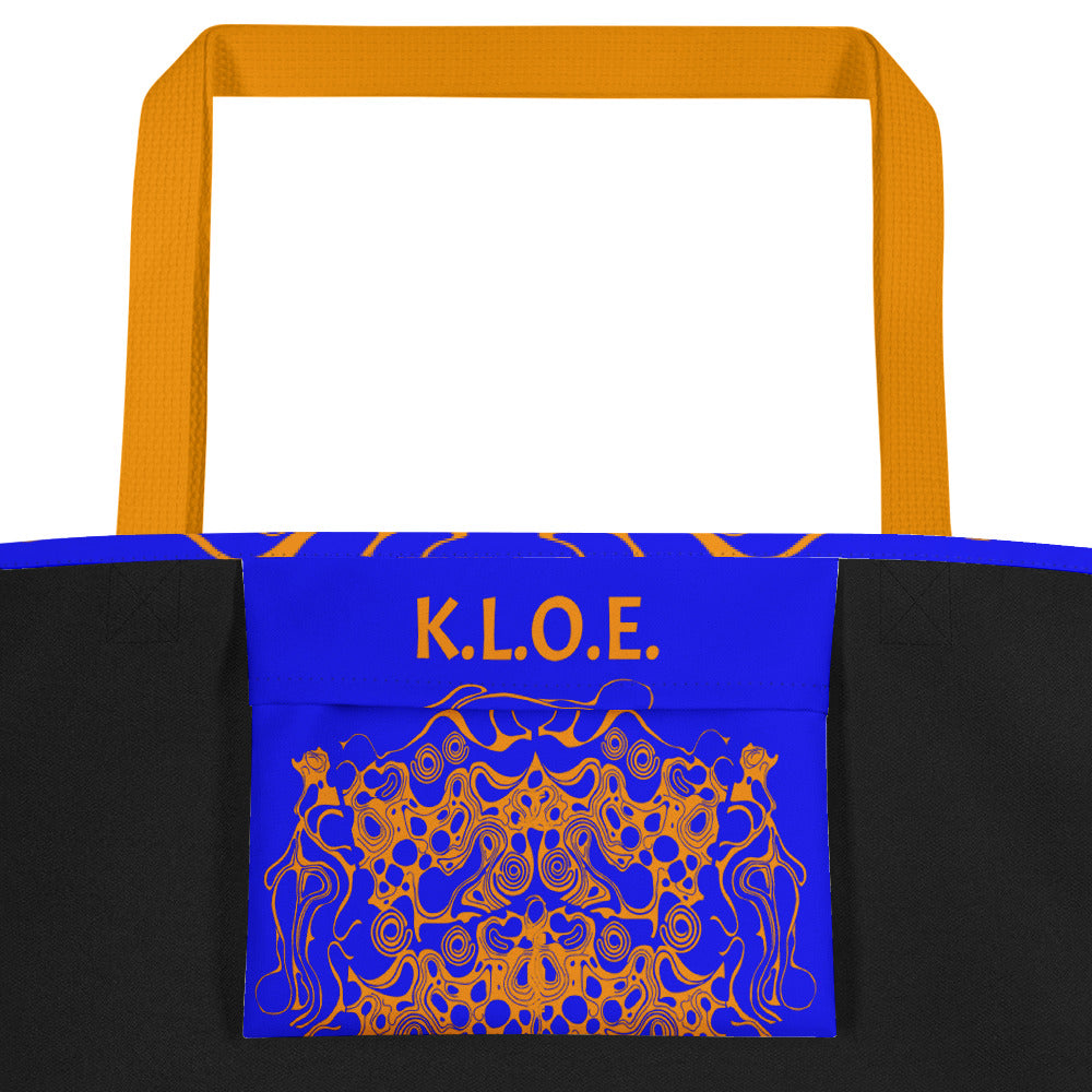 Bold blue and orange tote bag from Kloe Store featuring intricate abstract patterns, inside pocket..