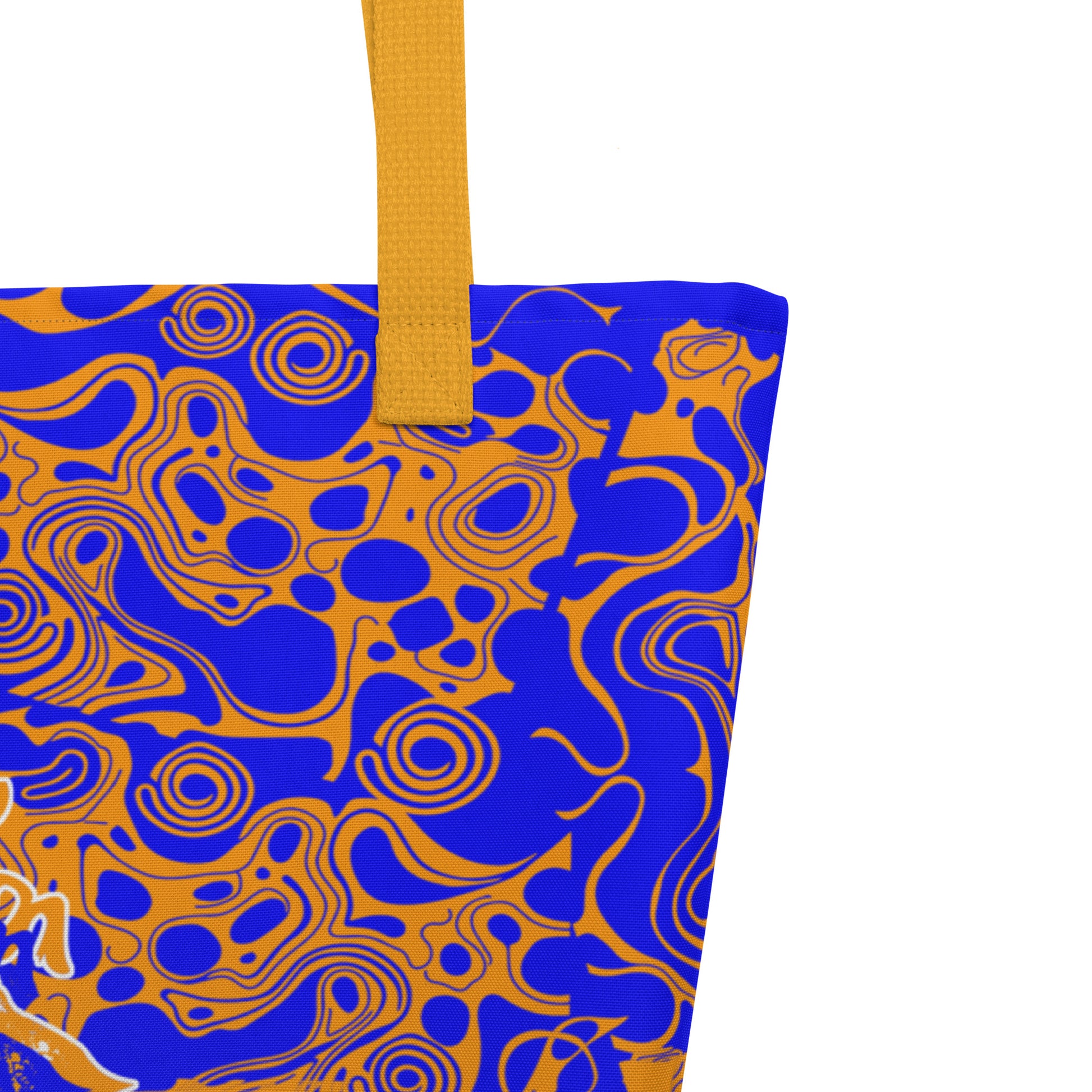 Bold blue and orange tote bag from Kloe Store featuring intricate abstract patterns and a central artistic face design, offering a stylish and edgy streetwear look.