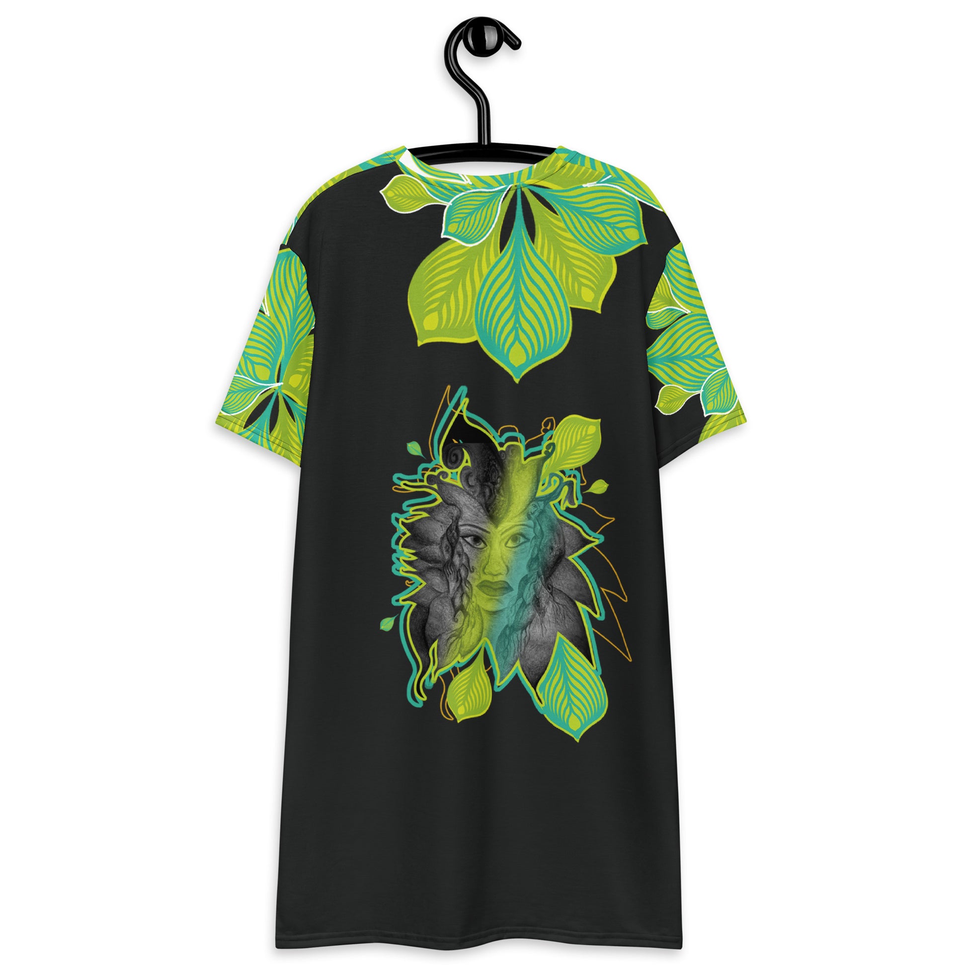 Back view of an all-over print K.L.O.E. t-shirt dress featuring vibrant green and yellow leaf patterns framing a detailed black and gray hand-drawn face design, celebrating individuality, modern bohemian style, and self-expression.