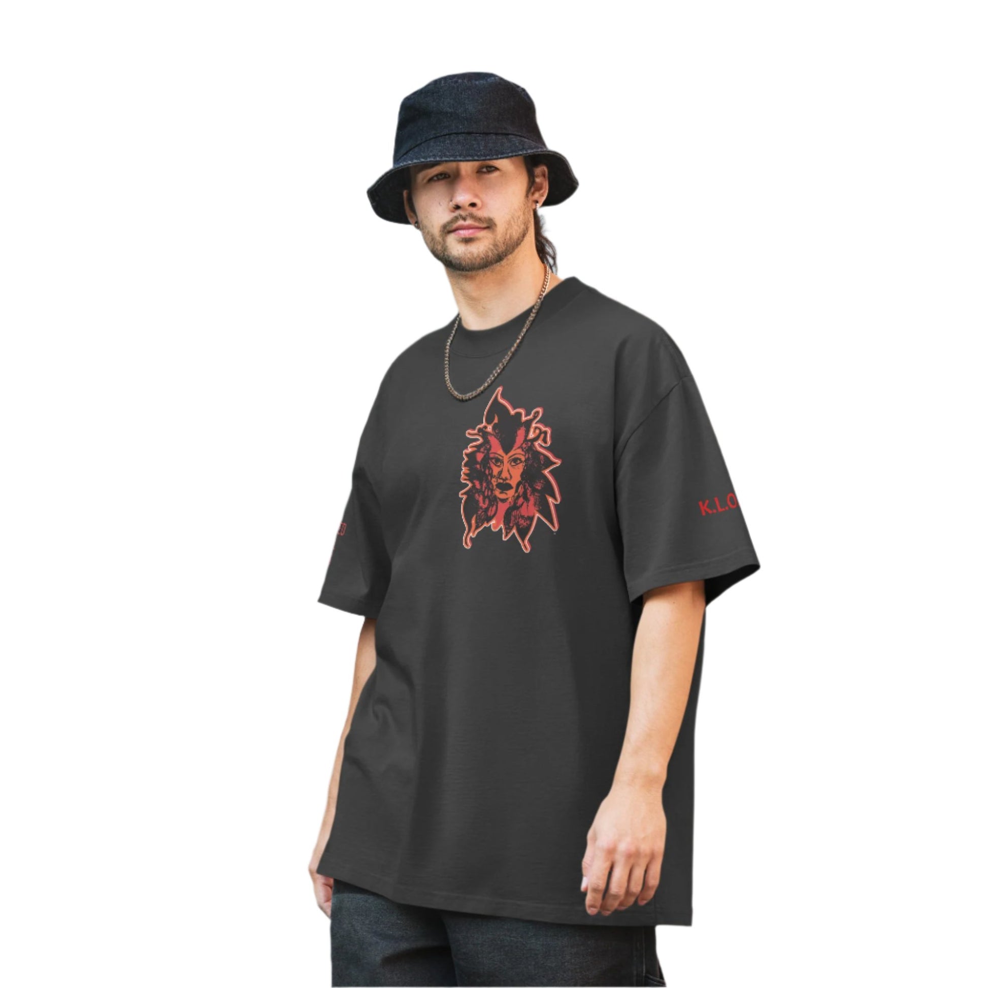 Black unisex oversized t-shirt featuring a striking red, hand-drawn face graphic on the back and front, inspired by global artistry and expressive fashion. The sleeve showcases ‘KEEN, LIBERATED, ORIGINAL, ENDLESS,’ embodying modern boho style and empowering individuality. A statement piece for those embracing contemporary, culturally inspired fashion.