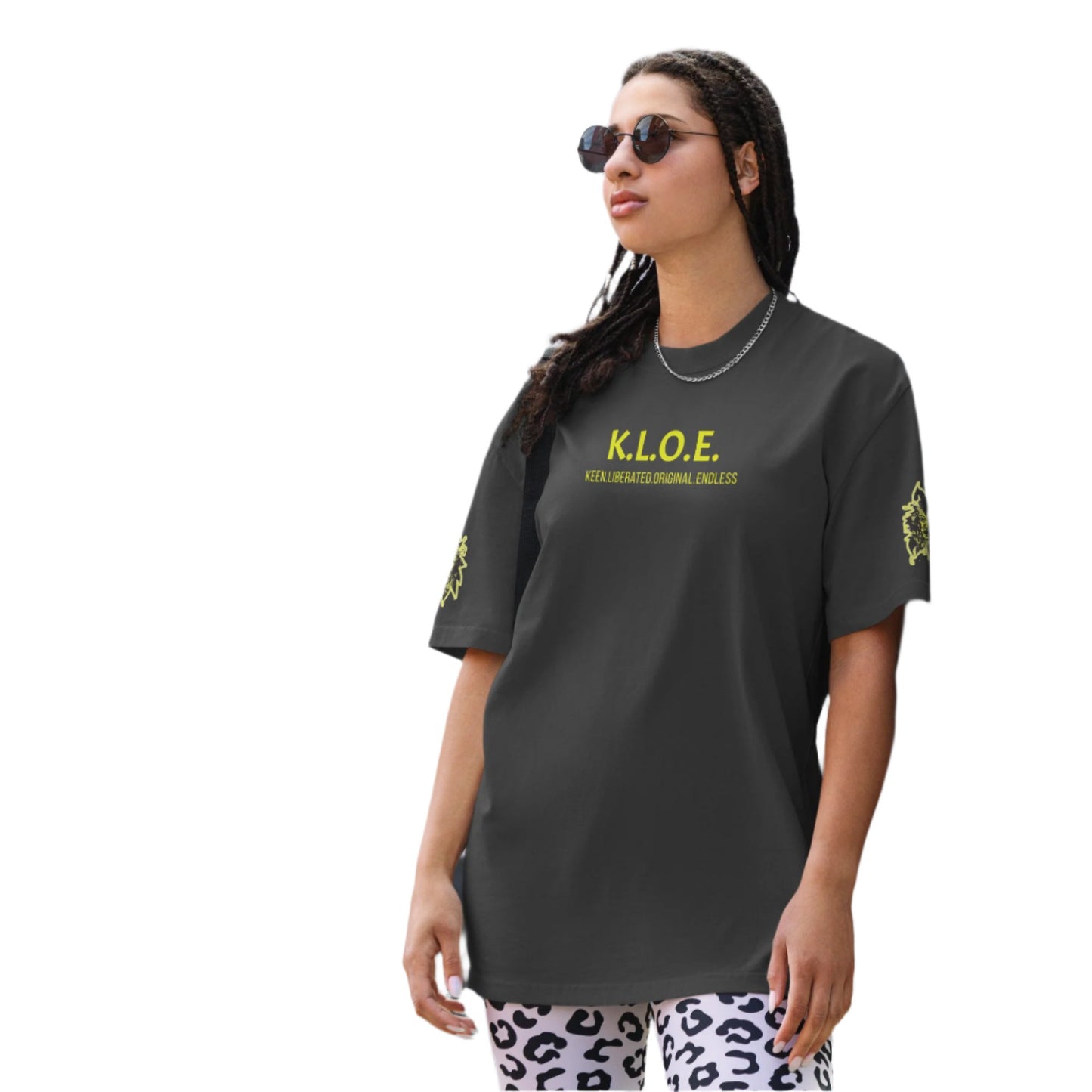 Black unisex oversized t-shirt with a bold yellow hand-drawn face graphic on the back, embodying culturally inspired fashion and modern boho style. The front features the K.L.O.E. logo and ‘KEEN, LIBERATED, ORIGINAL, ENDLESS’ text, celebrating individuality and expressive fashion for a contemporary, liberated lifestyle.