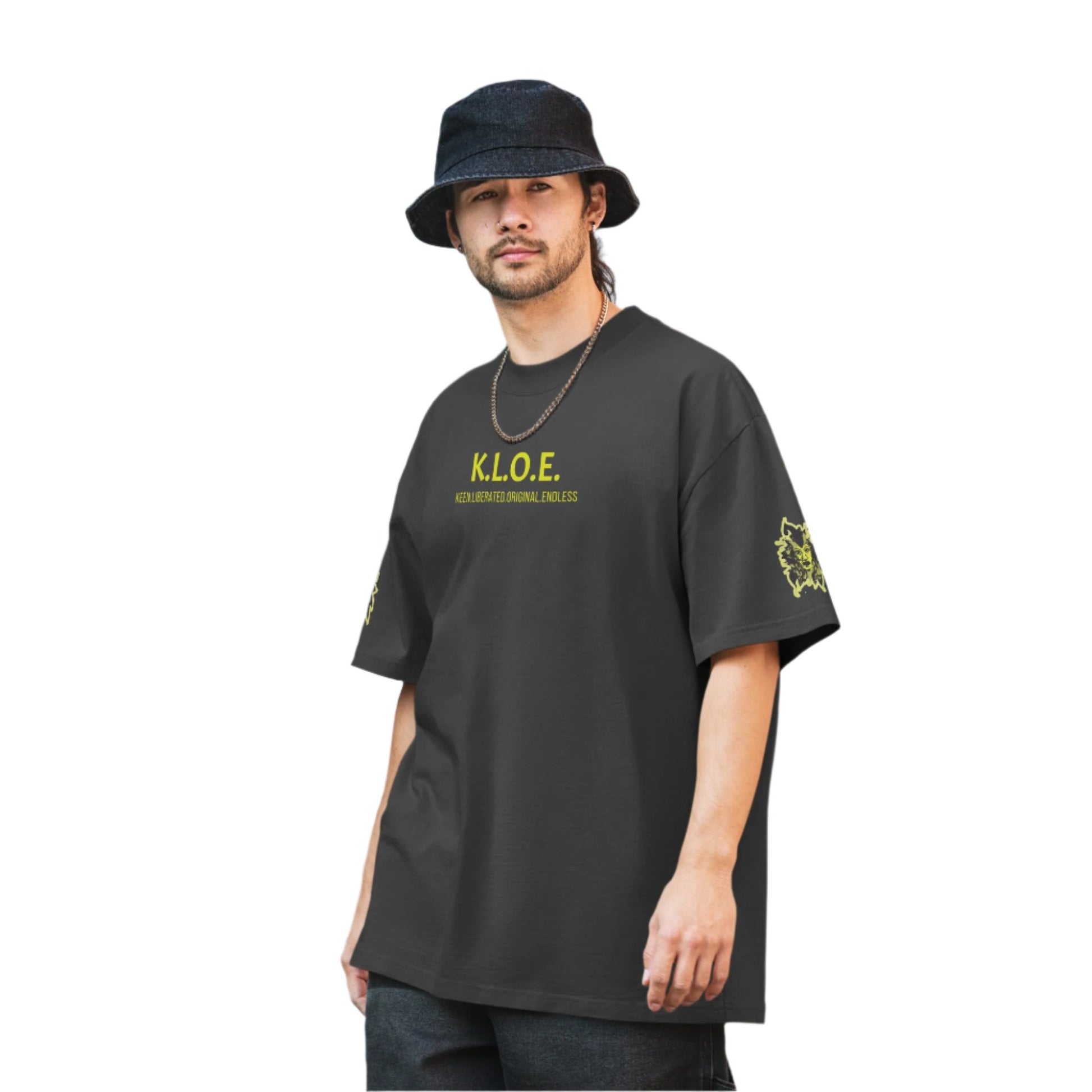 Black unisex oversized t-shirt with a bold yellow hand-drawn face graphic on the back, embodying culturally inspired fashion and modern boho style. The front features the K.L.O.E. logo and ‘KEEN, LIBERATED, ORIGINAL, ENDLESS’ text, celebrating individuality and expressive fashion for a contemporary, liberated lifestyle.