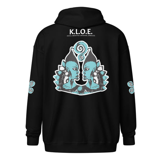 Black zip-up hoodie featuring a striking, hand-drawn graphic on the back of two mirrored female figures with intricate headpieces in black and teal, connected by a central spiral element. Teal spiral accents appear on each sleeve, adding a touch of cultural artistry. This K.L.O.E. design embodies modern boho style and expressive, artisan-crafted fashion, ideal for those who embrace unique, eco-friendly apparel and global inspiration.