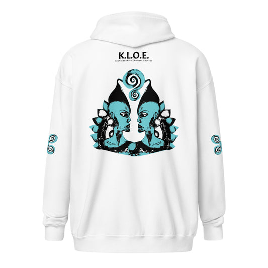 White zip-up hoodie featuring a striking, hand-drawn graphic on the back of two mirrored female figures with intricate headpieces in black and teal, connected by a central spiral element. Teal spiral accents appear on each sleeve, adding a touch of cultural artistry. This K.L.O.E. design embodies modern boho style and expressive, artisan-crafted fashion, ideal for those who embrace unique, eco-friendly apparel and global inspiration.