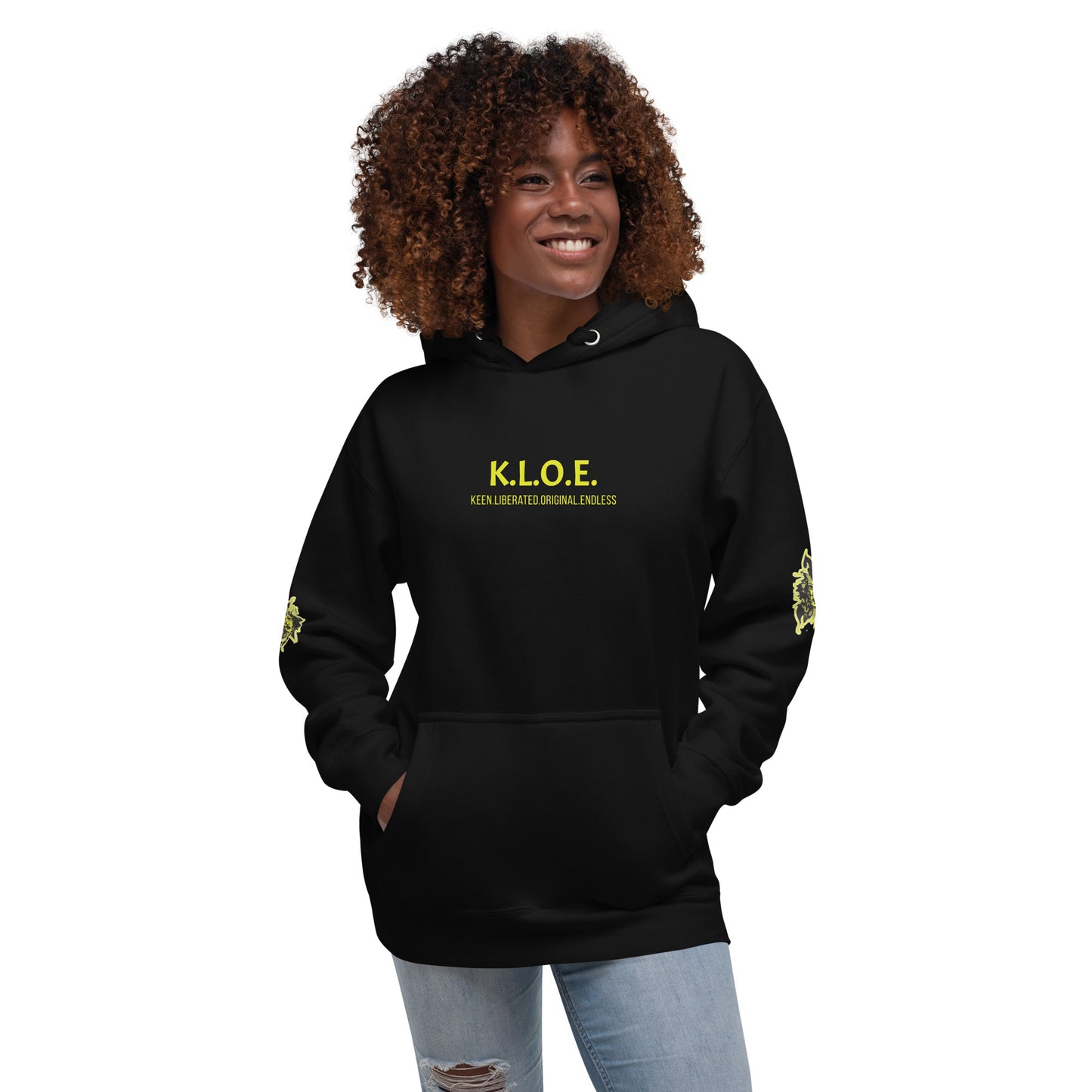 Black unisex hoodie with a bold yellow hand-drawn face graphic on the back, embodying culturally inspired fashion and modern boho style. The front features the K.L.O.E. logo and ‘KEEN, LIBERATED, ORIGINAL, ENDLESS’ text, celebrating individuality and expressive fashion for a contemporary, liberated lifestyle.