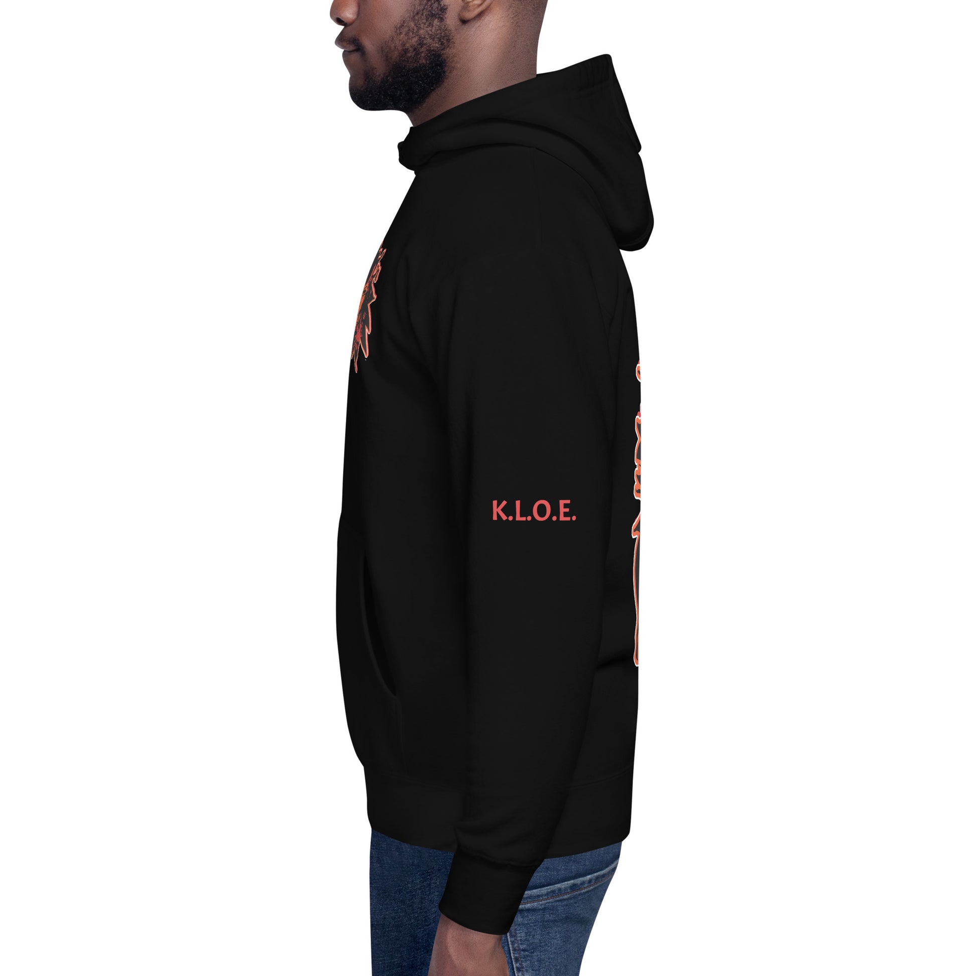 Black unisex hoodie featuring a striking red, hand-drawn face graphic on the back and front, inspired by global artistry and expressive fashion. The sleeve showcases ‘KEEN, LIBERATED, ORIGINAL, ENDLESS,’ embodying modern boho style and empowering individuality. A statement piece for those embracing contemporary, culturally inspired fashion.