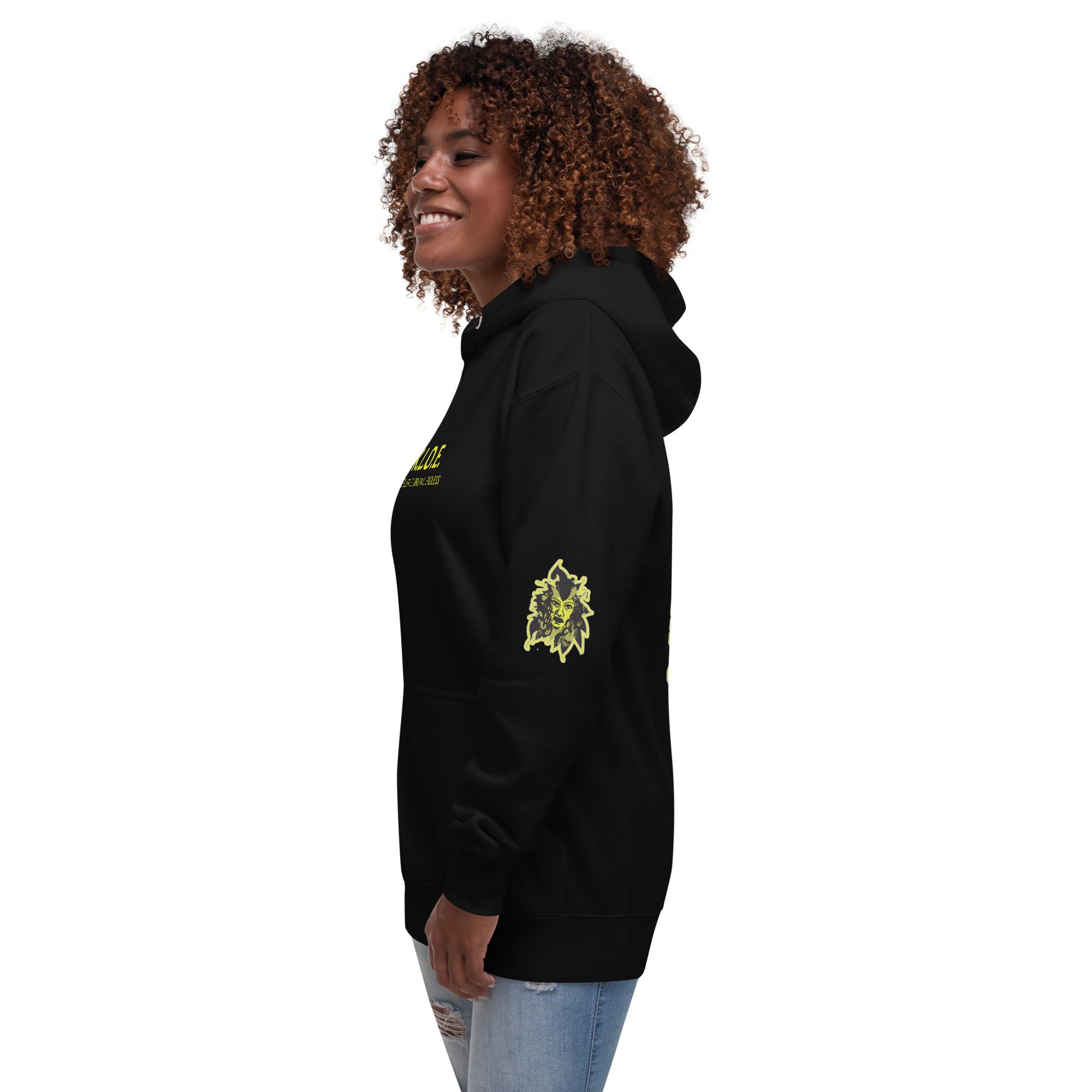 Black unisex hoodie with a bold yellow hand-drawn face graphic on the back, embodying culturally inspired fashion and modern boho style. The front features the K.L.O.E. logo and ‘KEEN, LIBERATED, ORIGINAL, ENDLESS’ text, celebrating individuality and expressive fashion for a contemporary, liberated lifestyle.