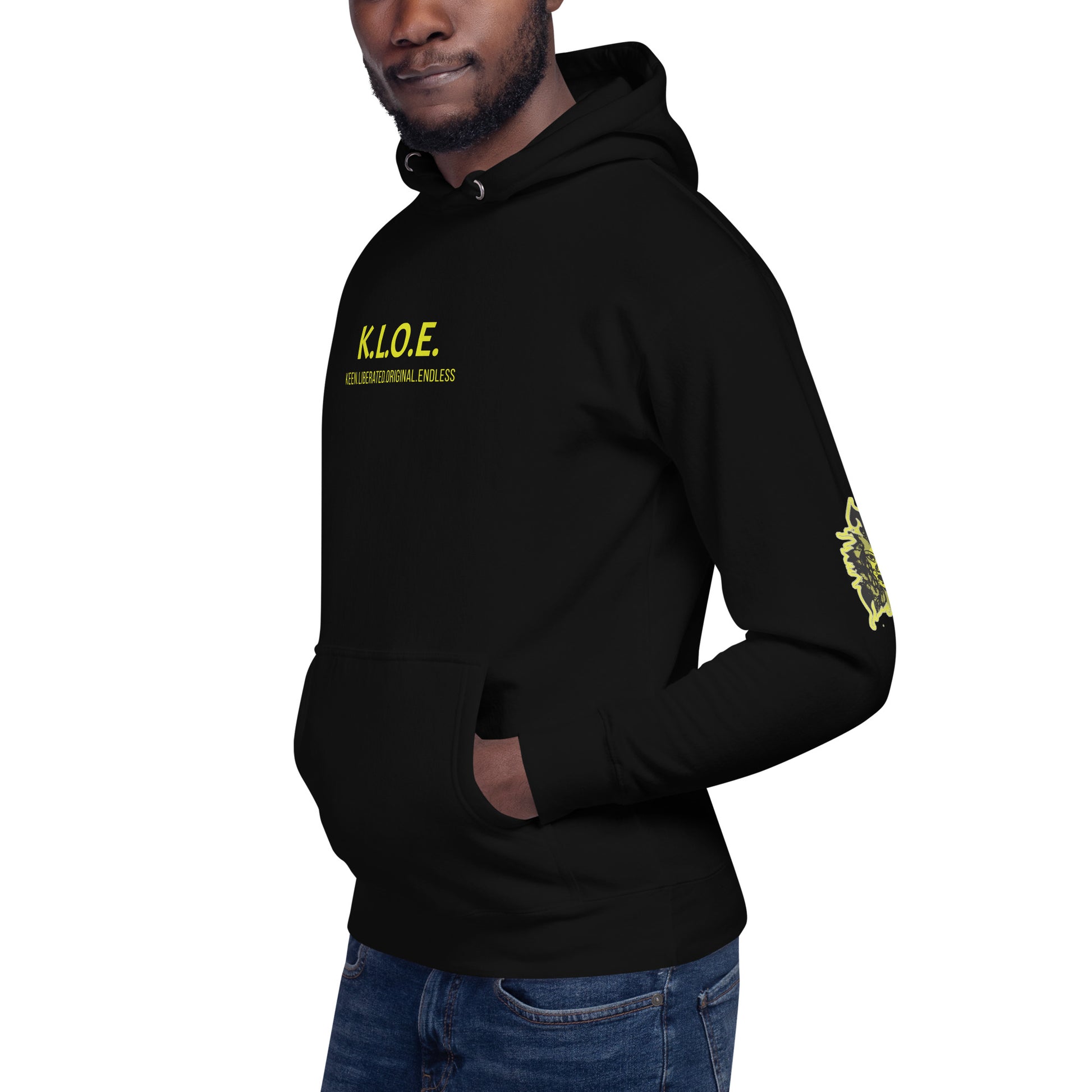 Black unisex hoodie with a bold yellow hand-drawn face graphic on the back, embodying culturally inspired fashion and modern boho style. The front features the K.L.O.E. logo and ‘KEEN, LIBERATED, ORIGINAL, ENDLESS’ text, celebrating individuality and expressive fashion for a contemporary, liberated lifestyle.