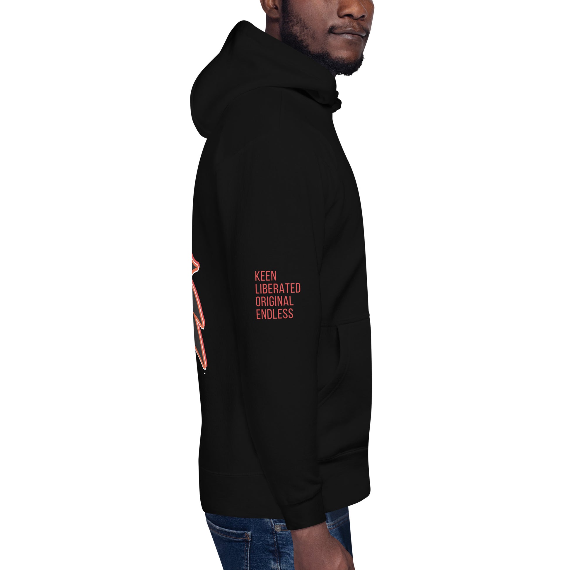 Black unisex hoodie featuring a striking red, hand-drawn face graphic on the back and front, inspired by global artistry and expressive fashion. The sleeve showcases ‘KEEN, LIBERATED, ORIGINAL, ENDLESS,’ embodying modern boho style and empowering individuality. A statement piece for those embracing contemporary, culturally inspired fashion.