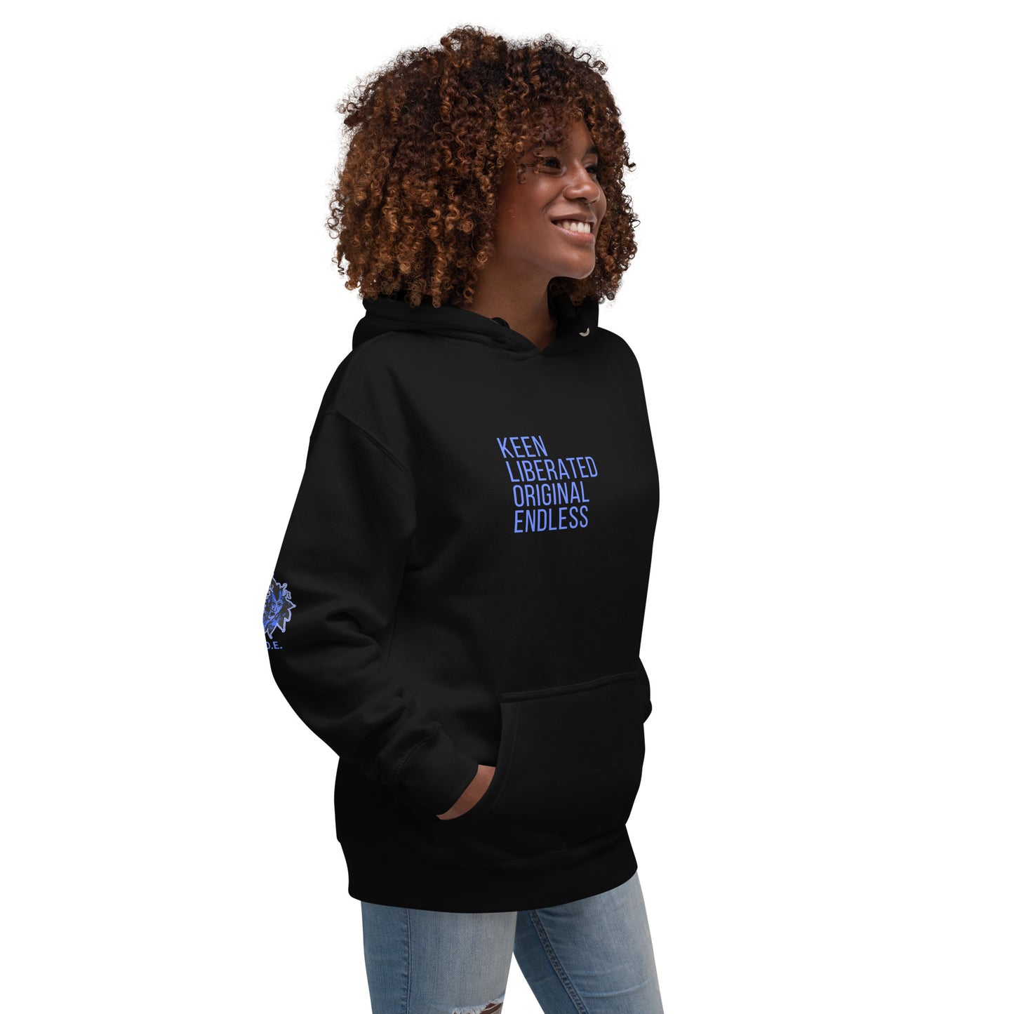 Black unisex K.L.O.E hoodie featuring a bold, hand-drawn blue graphic of an expressive face on the back, inspired by global artistry and modern boho style. The front showcases ‘KEEN, LIBERATED, ORIGINAL, ENDLESS’ text, celebrating individuality and self-expression. A contemporary fashion statement for those embracing artistic clothing and culturally inspired style.