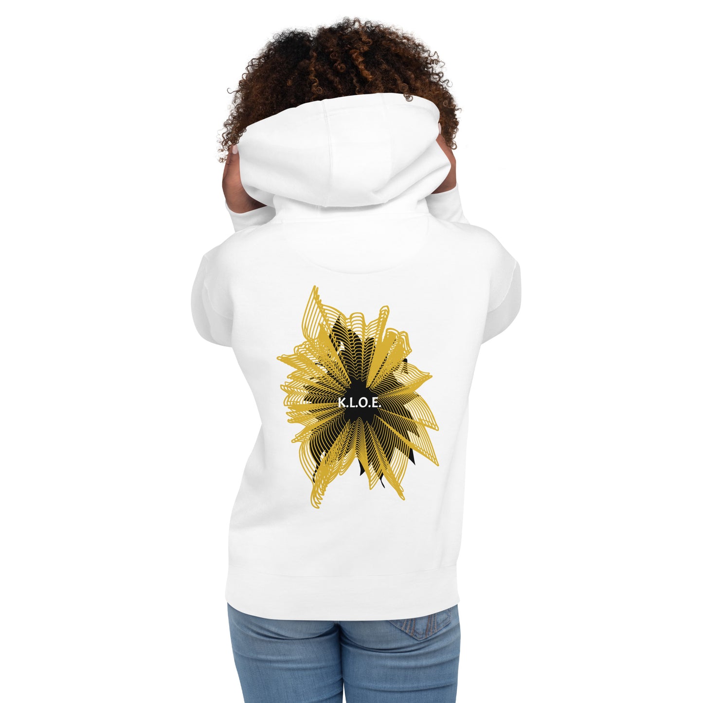 Back view of a white K.L.O.E. hoodie showcasing a bold hand-drawn golden abstract sunburst design with black accents and the K.L.O.E. logo—an artistic and empowering piece of culturally inspired, handcrafted fashion that blends modern boho style with expressive apparel, celebrating individuality and self-expression, worn by a model.