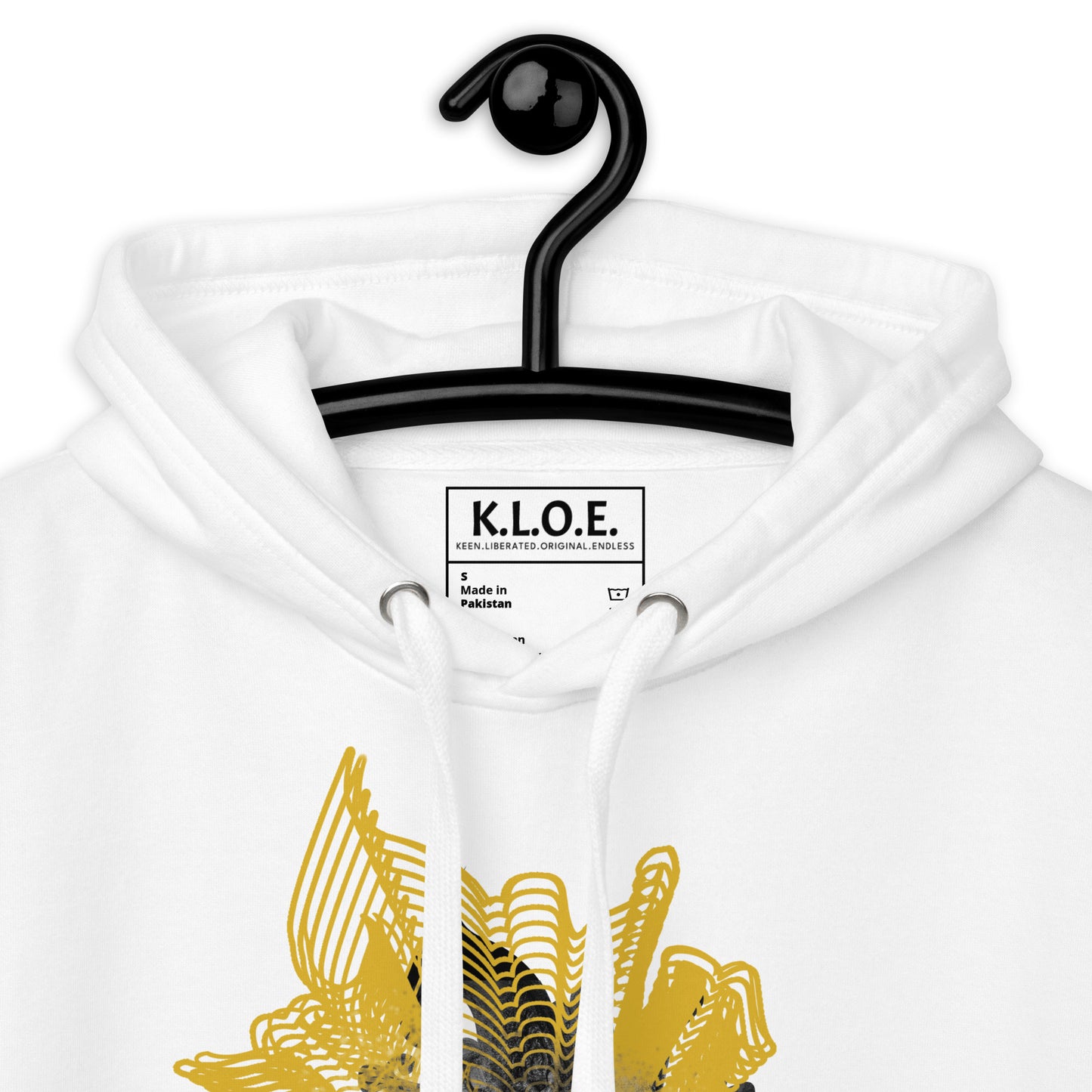 Detail view of a front side of a white K.L.O.E. hoodie featuring a striking hand-drawn face design surrounded by radiant golden abstract patterns—an artistic and empowering piece of handcrafted fashion, blending bohemian style clothing with contemporary fashion for bold self-expression and individuality.