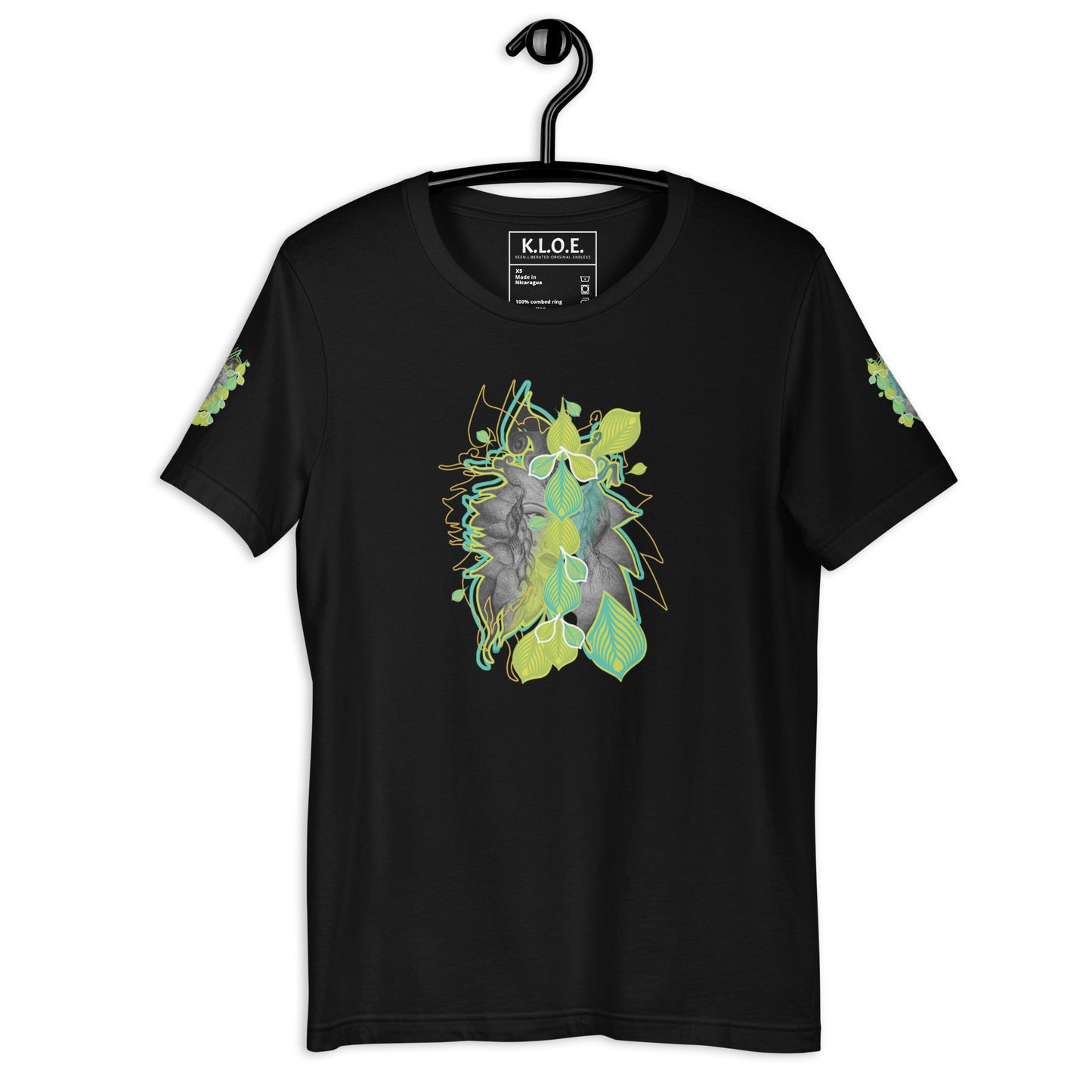 Front view of black K.L.O.E. t-shirt with vibrant green and yellow leaf patterns framing a detailed hand-drawn face design. A modern bohemian style statement that celebrates individuality, artistic expression, and culturally inspired fashion.