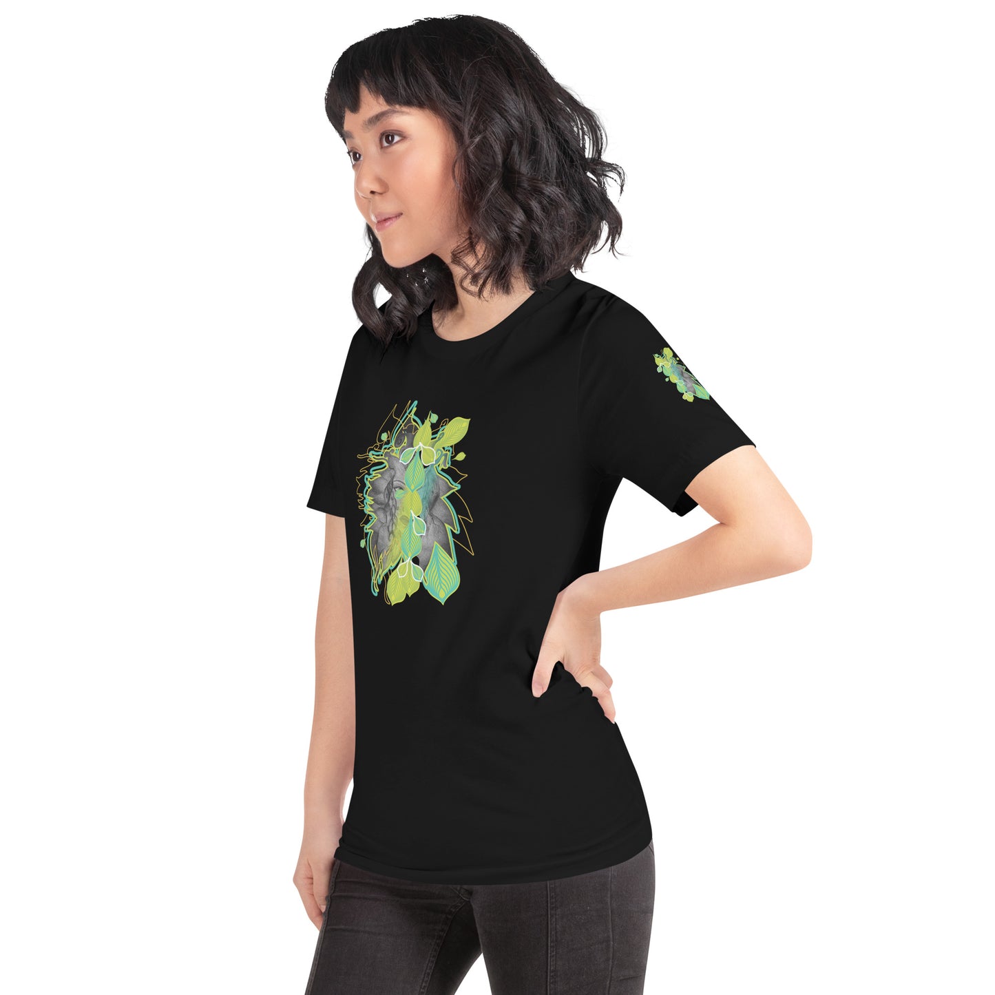 Front view of black K.L.O.E. t-shirt with vibrant green and yellow leaf patterns framing a detailed hand-drawn face design. A modern bohemian style statement that celebrates individuality, artistic expression, and culturally inspired fashion, on a model.