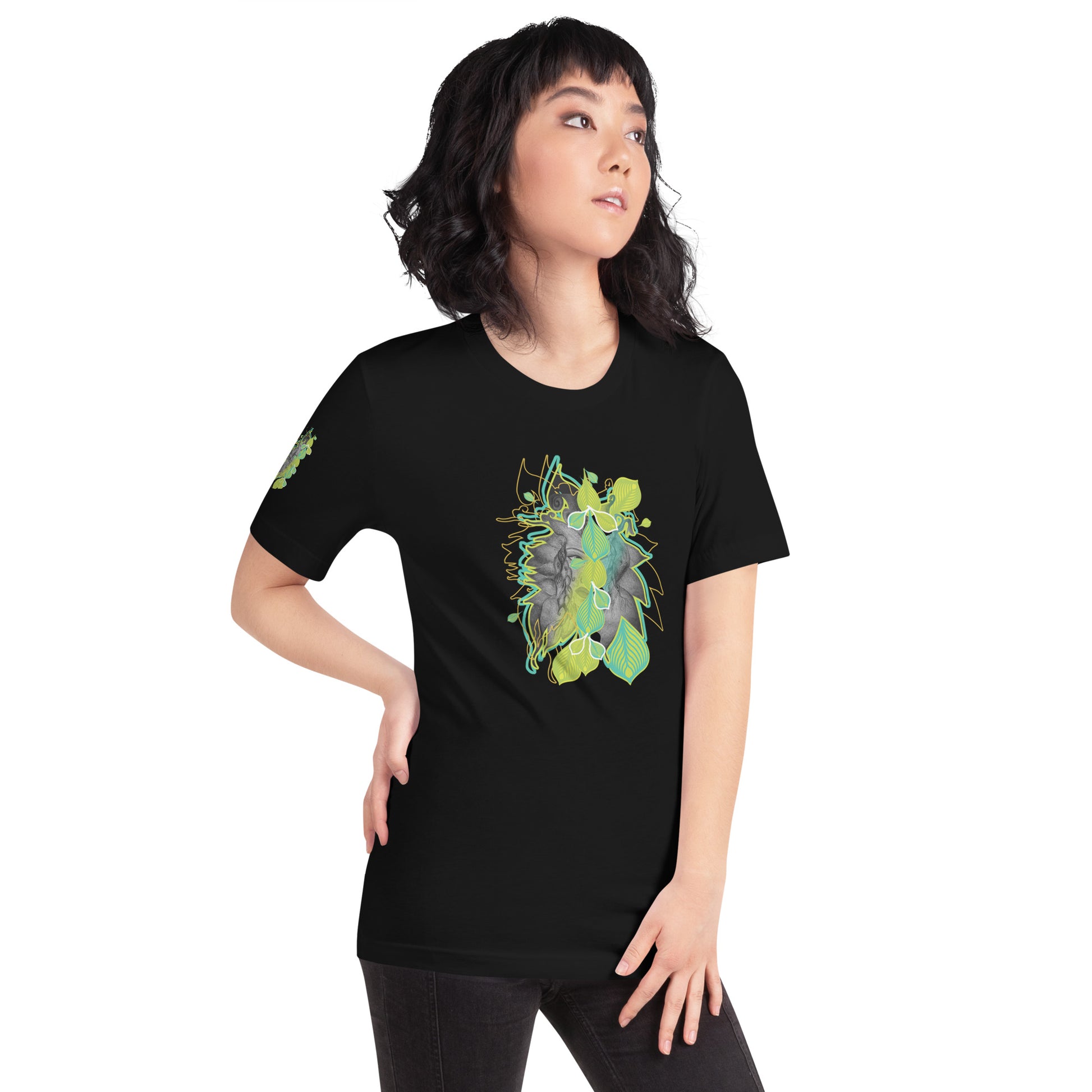 Front view of black K.L.O.E. t-shirt with vibrant green and yellow leaf patterns framing a detailed hand-drawn face design. A modern bohemian style statement that celebrates individuality, artistic expression, and culturally inspired fashion, on a model.