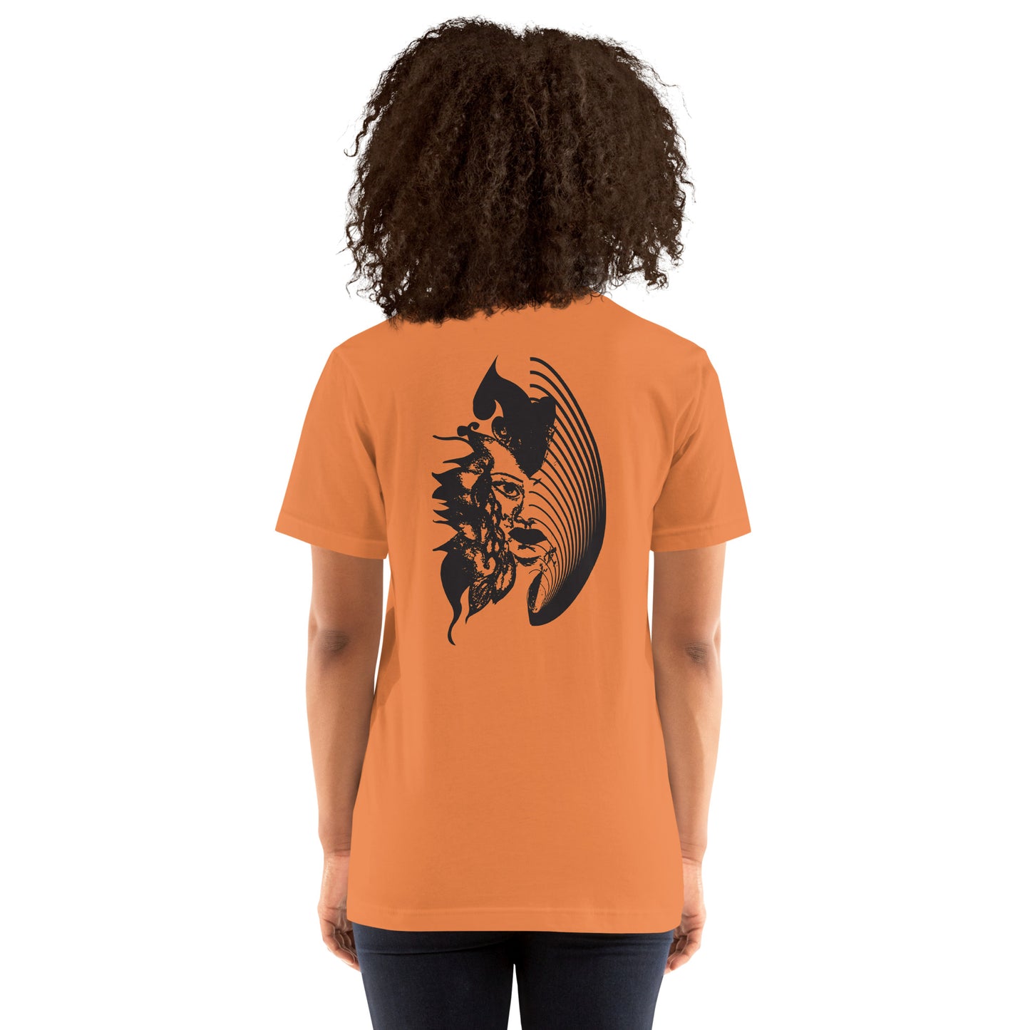 Back view of an orange K.L.O.E. T-shirt showcasing a culturally inspired, hand-drawn black design featuring a bold, expressive face intertwined with flowing, abstract patterns, embodying artistic self-expression and modern bohemian style fashion, on a model.