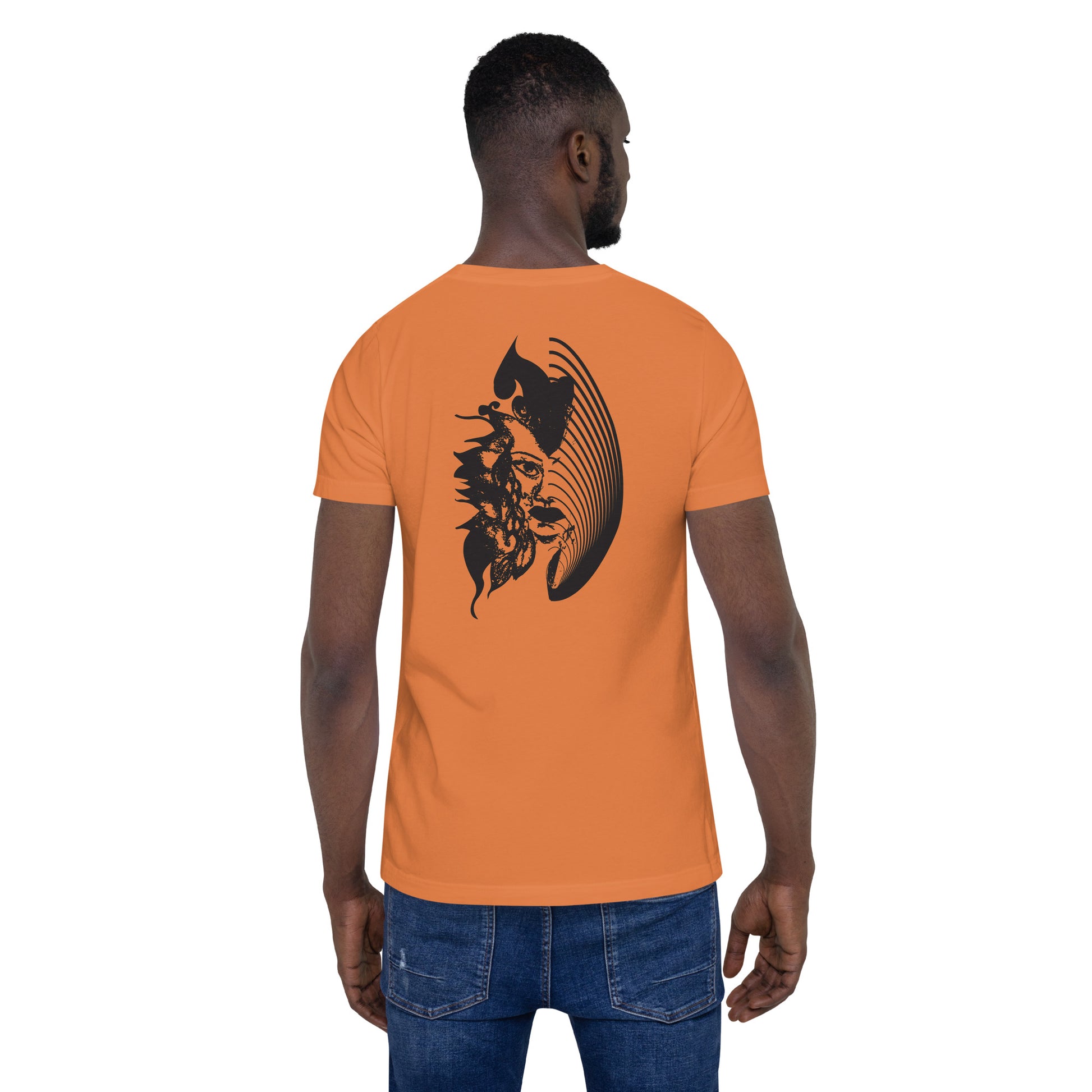 Back view of an orange K.L.O.E. T-shirt showcasing a culturally inspired, hand-drawn black design featuring a bold, expressive face intertwined with flowing, abstract patterns, embodying artistic self-expression and modern bohemian style fashion, on a model.