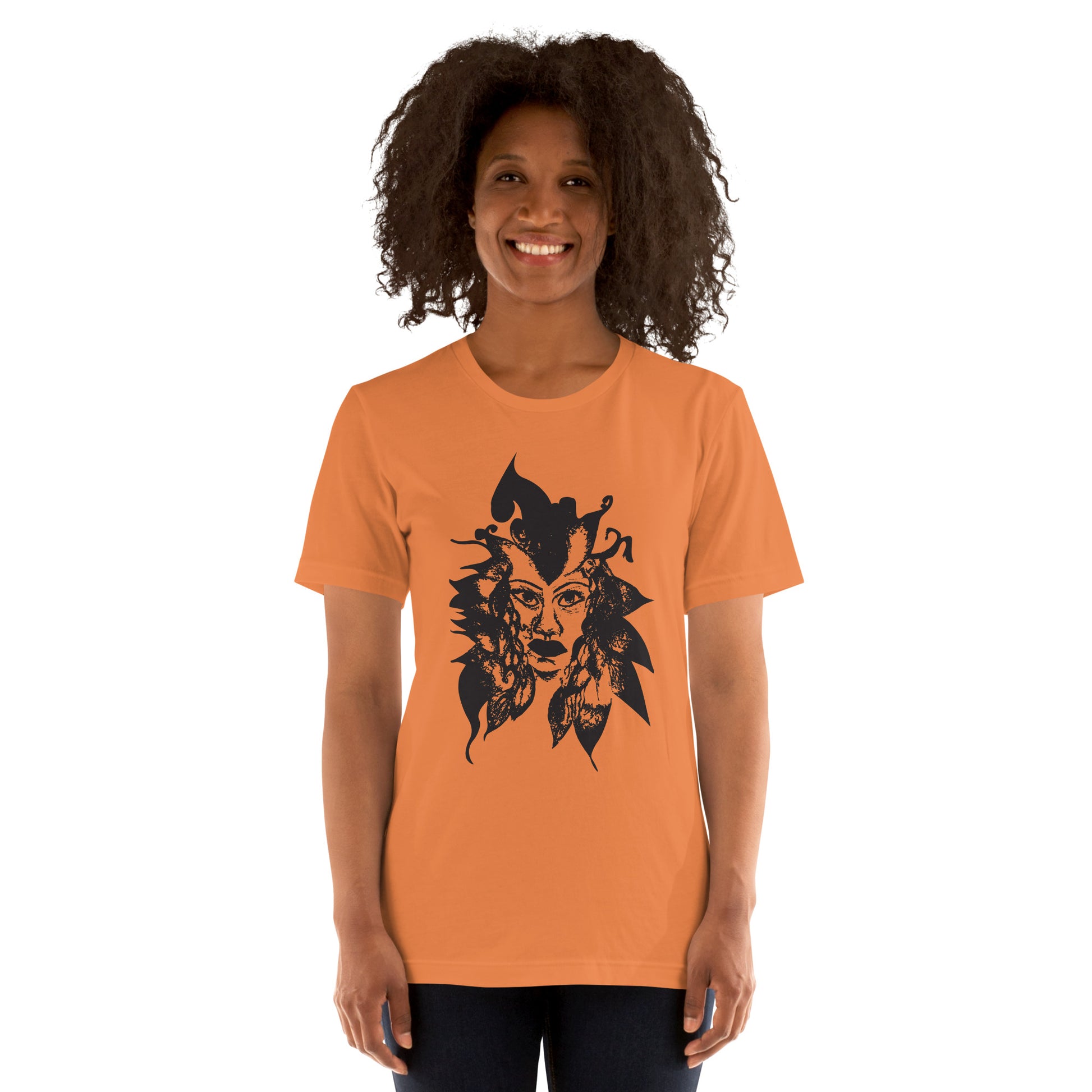 Orange K.L.O.E. T-shirt featuring a culturally inspired, hand-drawn black graphic of a bold, expressive face surrounded by intricate details, celebrating individuality and artistic self-expression in modern bohemian style fashion, on a model.