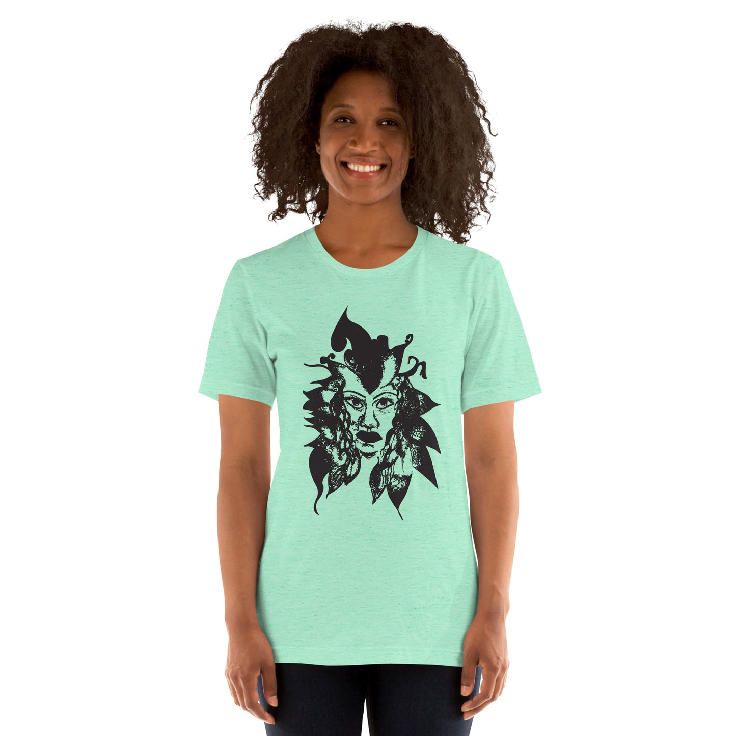 The model wearing mint K.L.O.E. T-shirt featuring a culturally inspired, hand-drawn black graphic of a bold, expressive face surrounded by intricate details, celebrating individuality and artistic self-expression in modern bohemian style fashion.