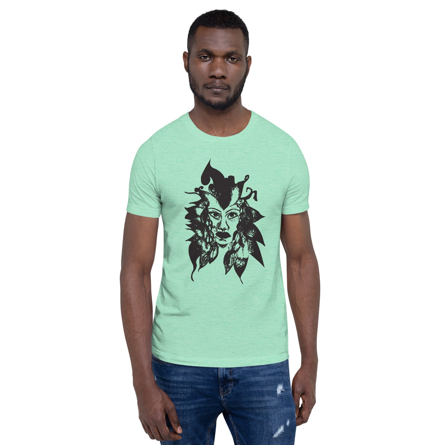 The model wearing mint K.L.O.E. T-shirt featuring a culturally inspired, hand-drawn black graphic of a bold, expressive face surrounded by intricate details, celebrating individuality and artistic self-expression in modern bohemian style fashion.