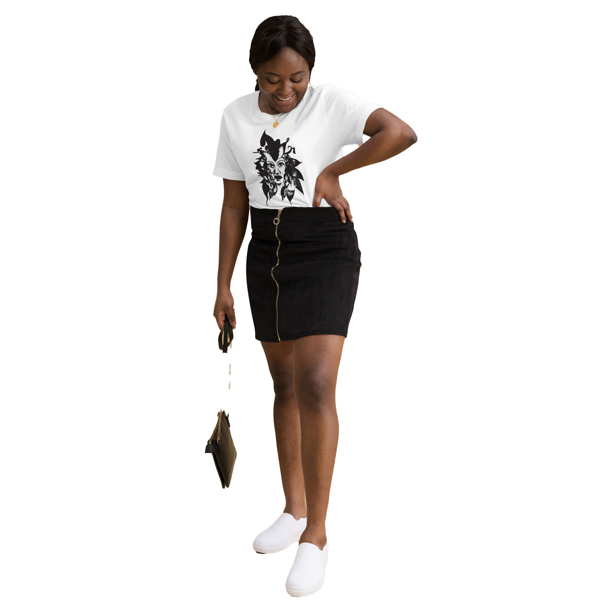 The model wearing the white K.L.O.E. T-shirt featuring a culturally inspired, hand-drawn black graphic of a bold, expressive face surrounded by intricate details, celebrating individuality and artistic self-expression in modern bohemian style fashion.