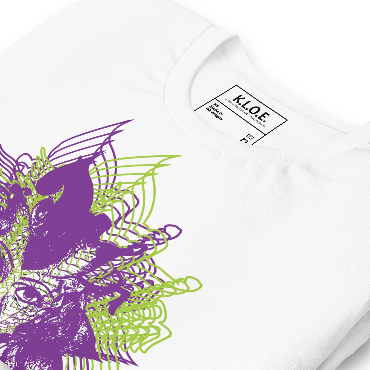 The inside label view of a white K.L.O.E. T-shirt featuring a vibrant hand-drawn face design in bold purple and green, surrounded by geometric and flowing patterns, celebrating individuality, artistic self-expression, and modern bohemian style fashion.