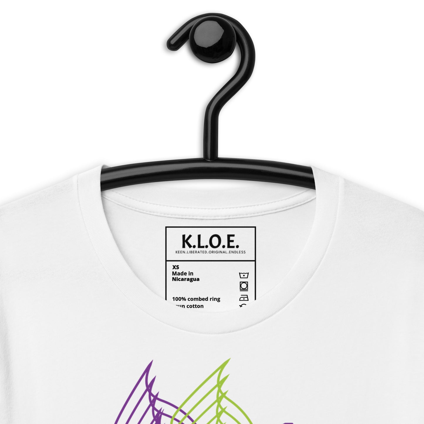 The inside label view of a white K.L.O.E. T-shirt featuring a vibrant hand-drawn face design in bold purple and green, surrounded by geometric and flowing patterns, celebrating individuality, artistic self-expression, and modern bohemian style fashion.