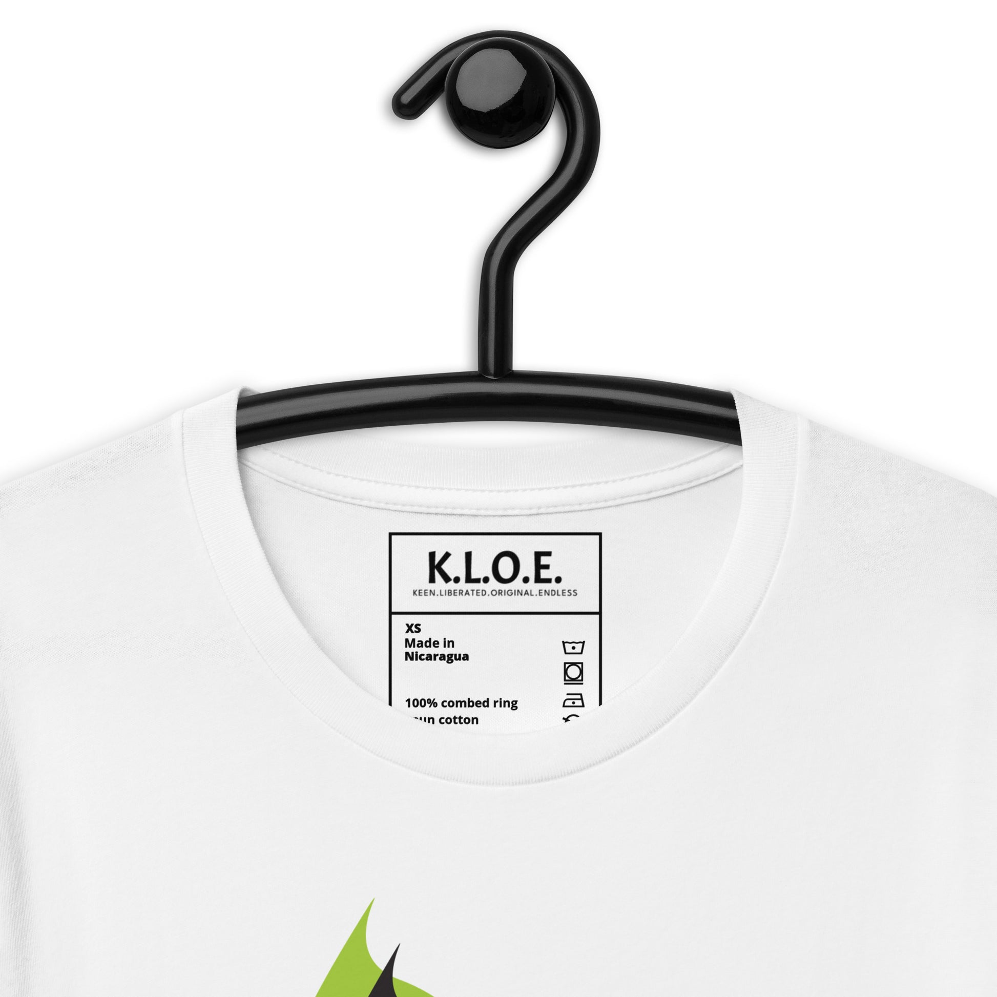 The inside label view of white K.L.O.E. T-shirt featuring a bold hand-drawn face design in black and vibrant green, surrounded by sharp, abstract patterns, celebrating individuality, artistic self-expression, and modern bohemian style fashion.