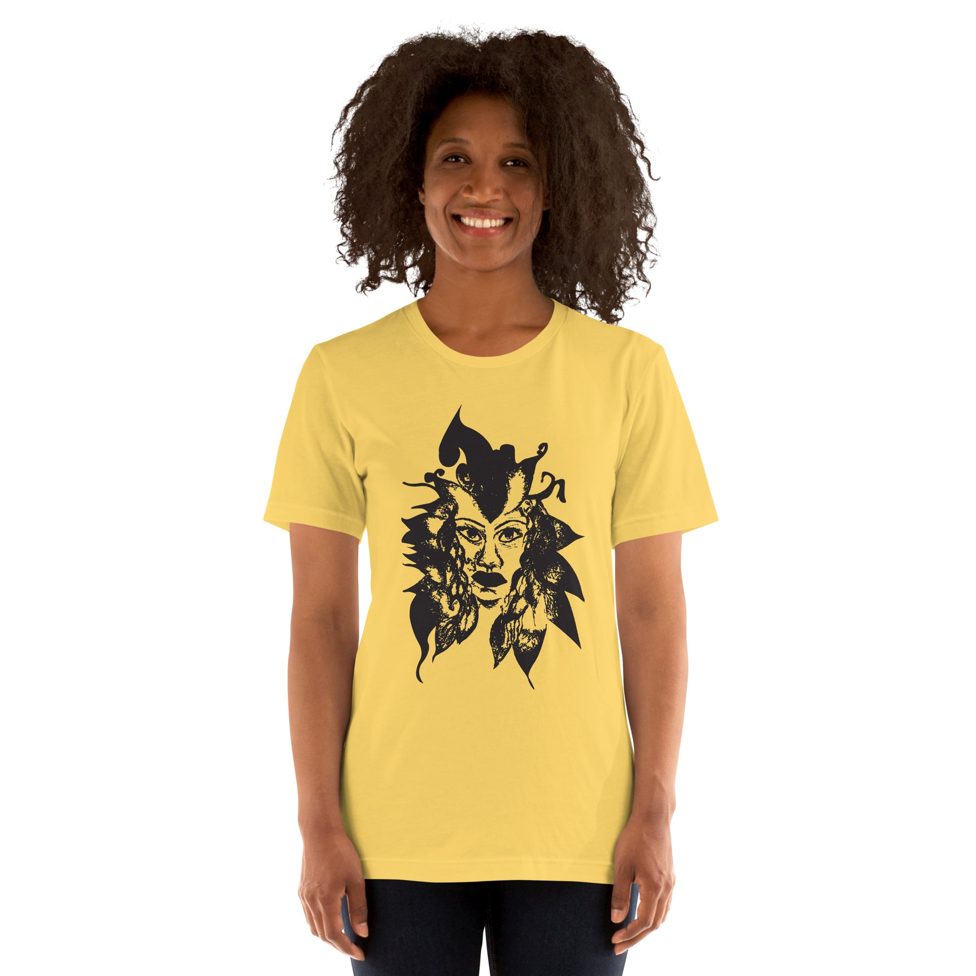 The model wearing yellow K.L.O.E. T-shirt featuring a culturally inspired, hand-drawn black graphic of a bold, expressive face surrounded by intricate details, celebrating individuality and artistic self-expression in modern bohemian style fashion.