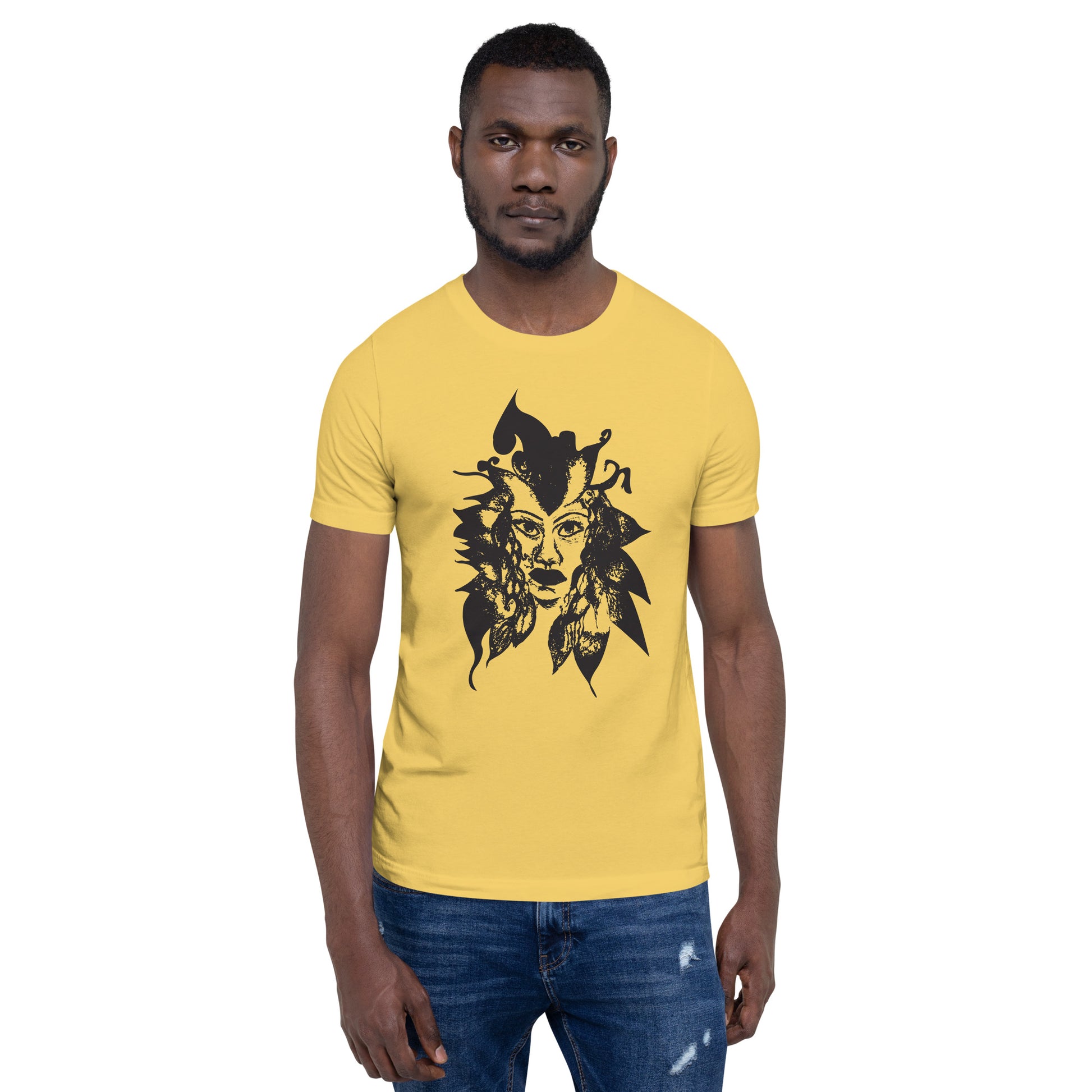 The model wearing yellow K.L.O.E. T-shirt featuring a culturally inspired, hand-drawn black graphic of a bold, expressive face surrounded by intricate details, celebrating individuality and artistic self-expression in modern bohemian style fashion.