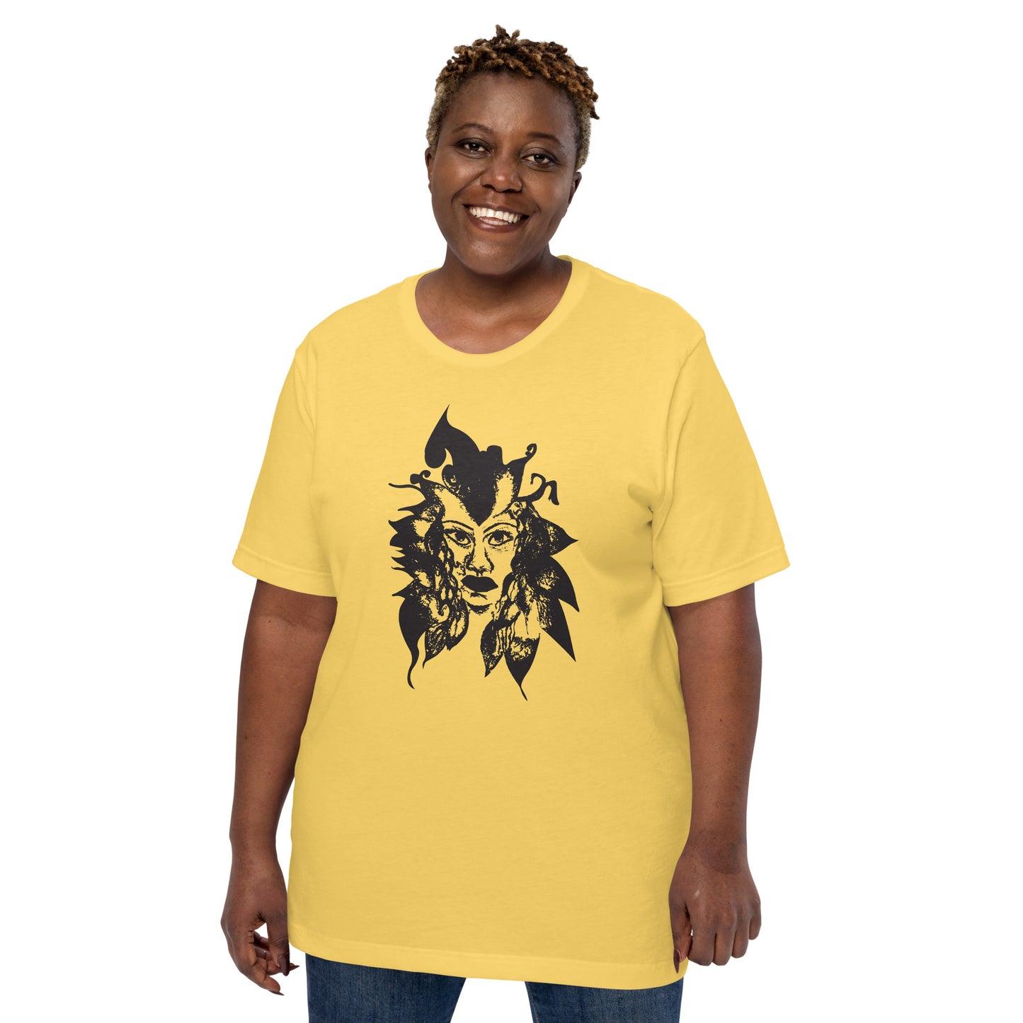 The model wearing yellow K.L.O.E. T-shirt featuring a culturally inspired, hand-drawn black graphic of a bold, expressive face surrounded by intricate details, celebrating individuality and artistic self-expression in modern bohemian style fashion.