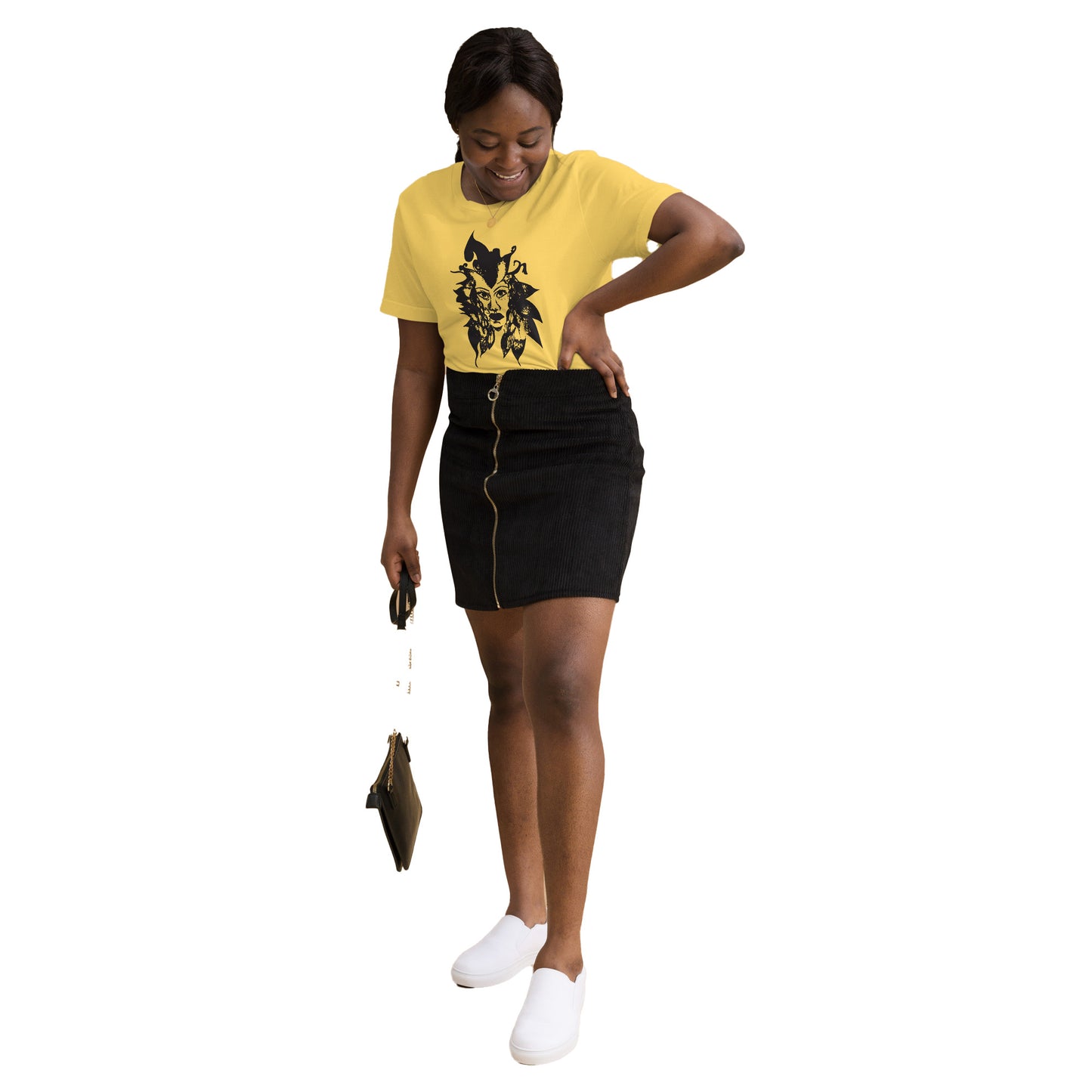 The model wearing yellow K.L.O.E. T-shirt featuring a culturally inspired, hand-drawn black graphic of a bold, expressive face surrounded by intricate details, celebrating individuality and artistic self-expression in modern bohemian style fashion.